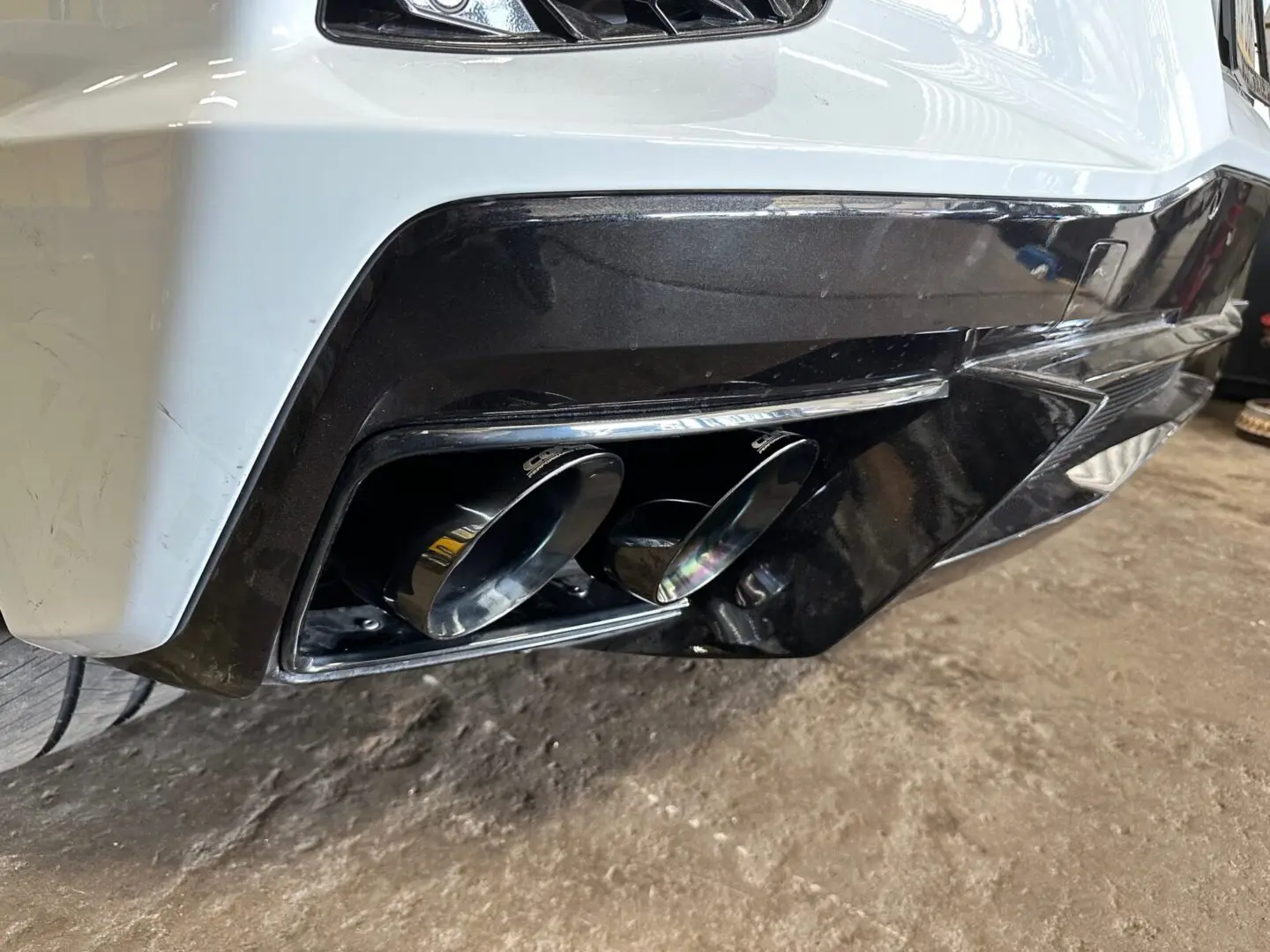 A close up of the exhaust pipes on a car