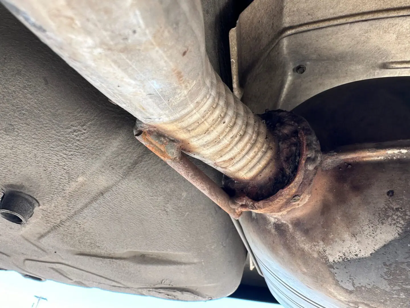 A close up of the exhaust pipe on a car