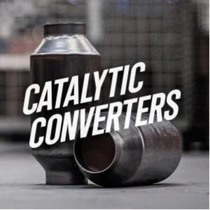 A catalytic converters sitting on top of the floor.